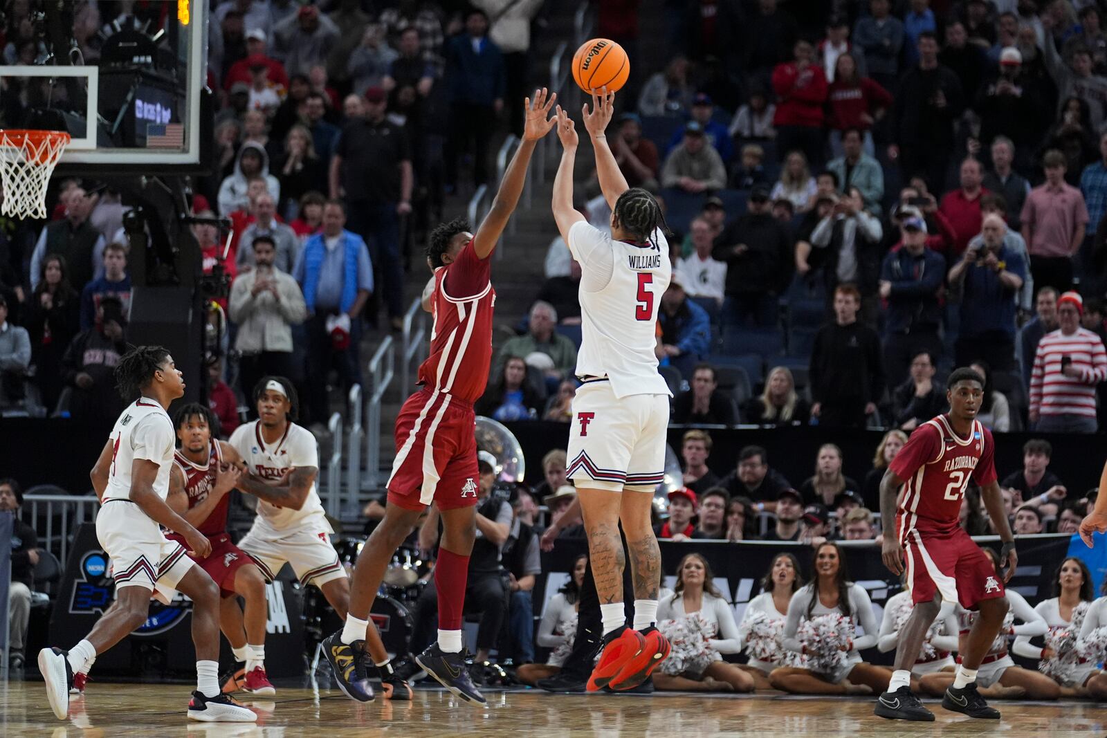 Texas Tech forward Darrion Williams (5) shoots a 3-pointer during the second half in the Sweet 16 of the NCAA college basketball tournament game against Arkansas, Thursday, March 27, 2025, in San Francisco. (AP Photo/Marcio Jose Sanchez)