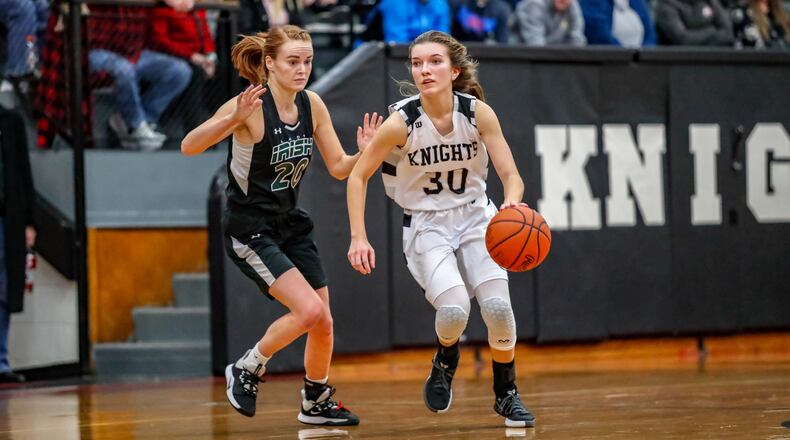 Greenon High School senior Reagan Ware is guarded by Catholic Central’s Lizzie Bruce during their game on Tuesday, Jan. 22. The Knights won 51-46. CONTRIBUTED PHOTO BY MICHAEL COOPER