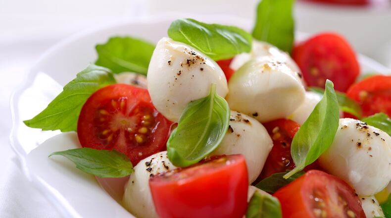 Whitney Kling's child requested a Caprese salad for a school lunch. Shown here is one with mozzarella cheese, tomato, basil, olive oil and pepper. ISTOCK