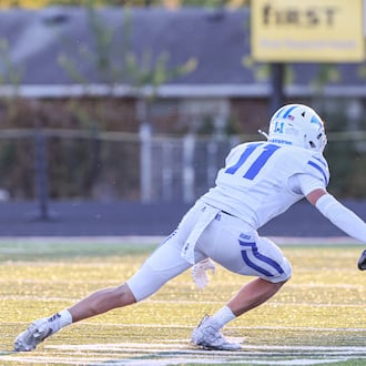 Wayne junior receiver Jamier Brown (right) tries to avoid Springboro's rice Markoff during a Greater Western Ohio Conference game on Friday, Sept. 12 at Heidkamp Stadium. Brown, an Ohio State recruit, had over 250 all-purpose yards and scored two touchdowns. BRYANT BILLING / STAFF