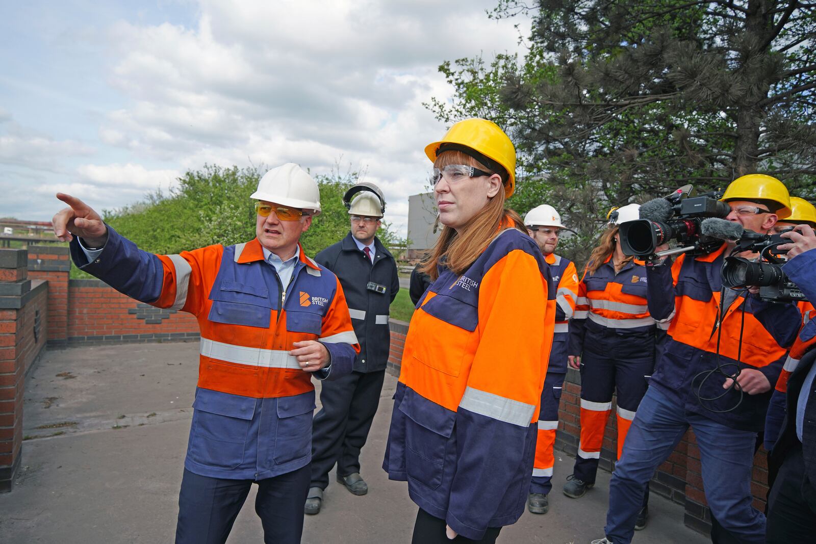 British Deputy Prime Minister Angela Rayner and technical director Chris Vaughan, left, view blast furnaces during her visit to the British Steel site in Scunthorpe in Scunthorpe, England, Monday April 14, 2025. (Peter Byrne, Pool Photo via AP)