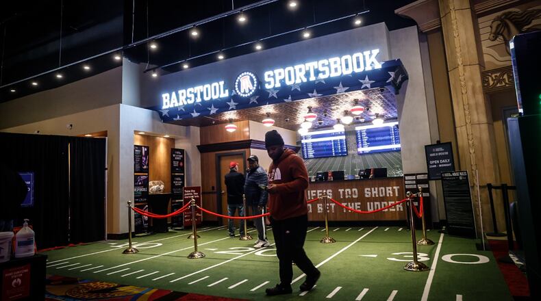 Gamblers, foodies and goodtime seekers walk the aisles at Hollywood Gaming at Dayton Raceway Friday afternoon, Jan. 13, 2023. JIM NOELKER/STAFF