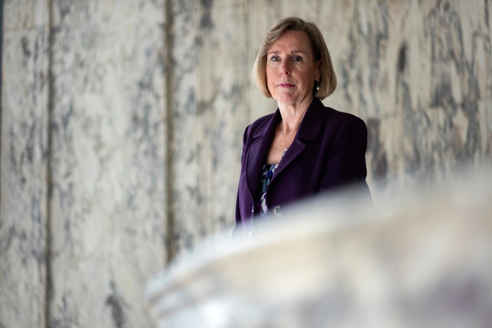 Mary Wearn, president of Georgia Humanities, poses for a portrait in the rotunda of the historic Hurt building where their offices are located in Atlanta, Wednesday, April 9, 2025. (AP Photo/Ben Gray)