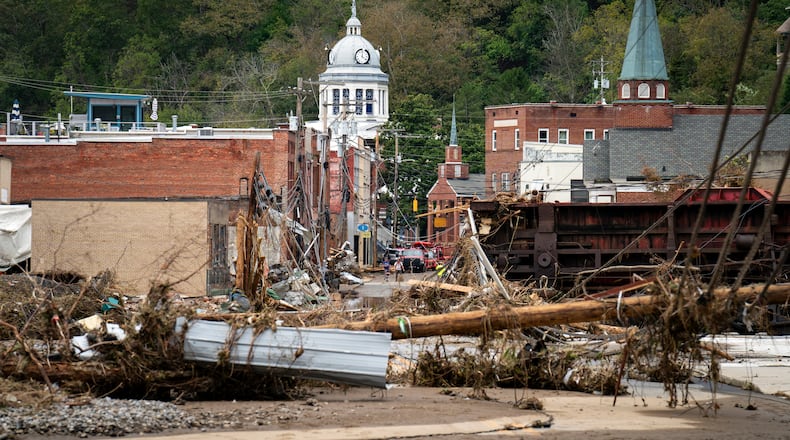 Wreckage caused by Hurricane Helene covers the streets of downtown Marshall, N.C., outside Asheville, on Sunday, Sept. 29, 2024. Flooding fueled by the remnants of Hurricane Helene washed away hundreds of roads and grievously damaged many others. In many places, there is no timeline for fixing them. (Nicole Craine/The New York Times)