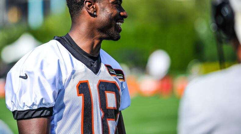 Wide receiver A.J. Green smiles as he is interviewed after the first day of Cincinnati Bengals Training Camp Friday, July 28 at the practice fields beside Paul Brown Stadium in Cincinnati. NICK GRAHAM/STAFF