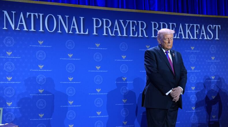 President Donald Trump bows his head during the National Prayer Breakfast, Thursday, Feb. 5, 2026, in Washington. (AP Photo/Evan Vucci)