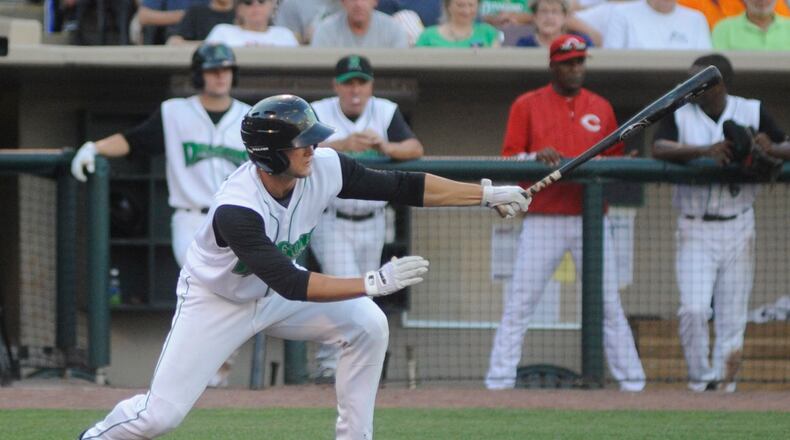 Nick Senzel of the Dragons makes contact during a game last season. MARC PENDLETON / STAFF
