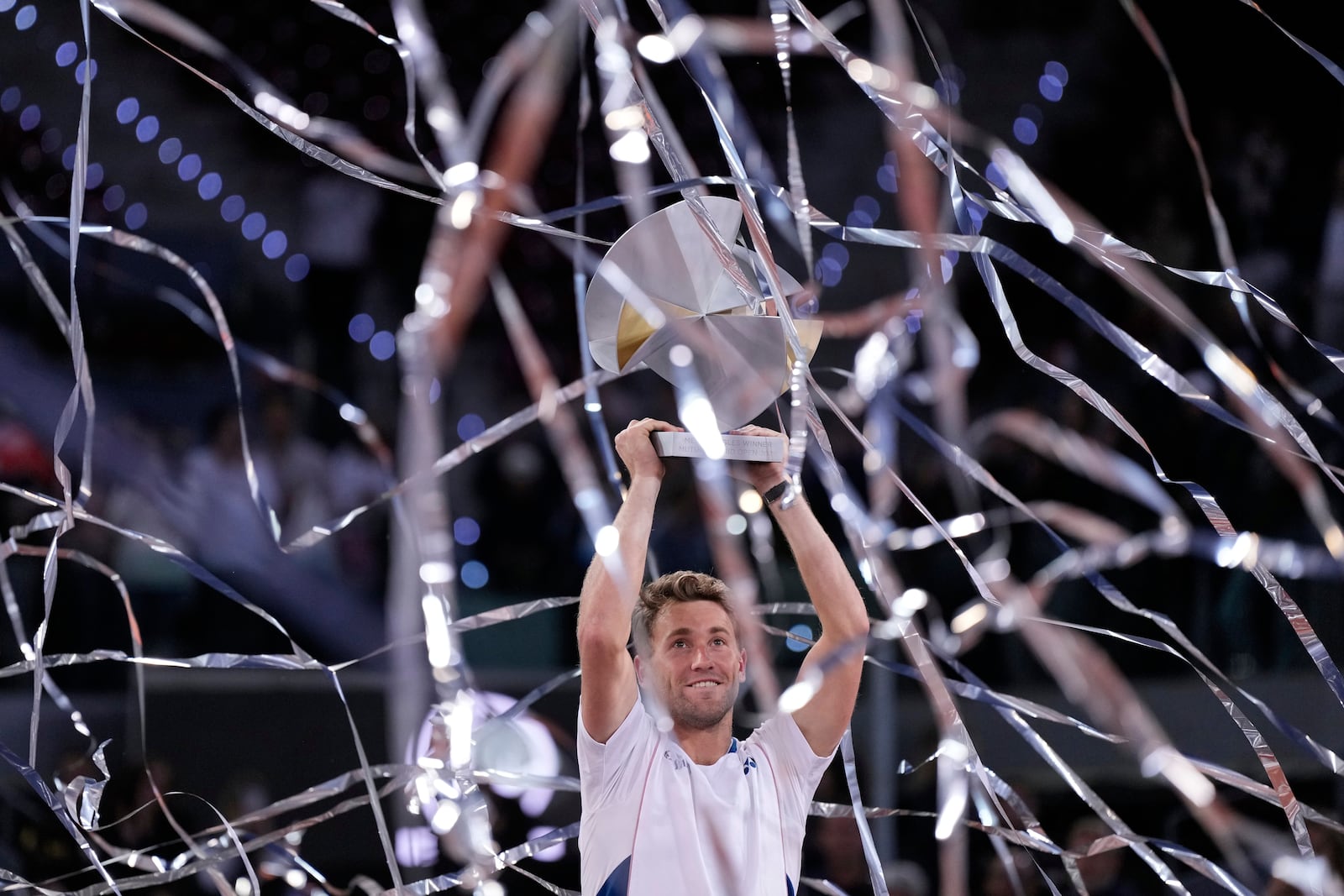 Norway's Casper Ruud holds the trophy after winning the Madrid Open tennis final in Madrid, Spain, Sunday, May 4, 2025. (AP Photo/Manu Fernandez)