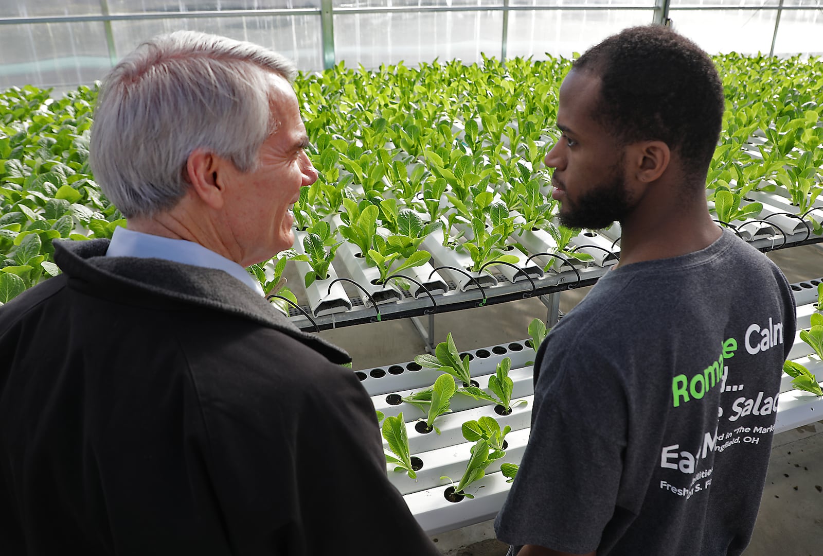Senator Rob Portman talks with Kristopher Belle, an employee of The Abilities Connection, Wednesday in the hydroponic greenhouse at TAC. Senator Portman was touing the facilities following a meeting with TAC's leadership. BILL LACKEY/STAFF