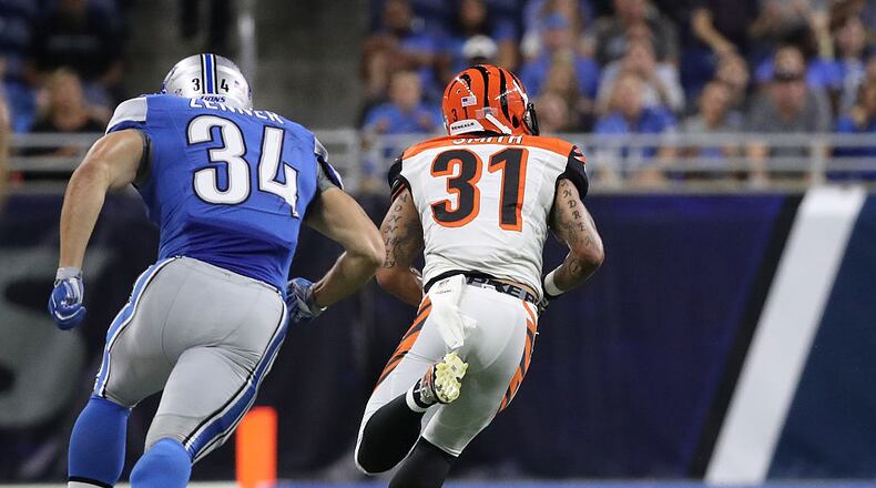 DETROIT, MI - AUGUST 18: Derron Smith #31 of the Cincinnati Bengals makes the pickoff of the pass from Dan Orlovsky (not in photo) and runs for a second quarter touchdown during the preseason game against the Detroit Lions at Ford Field on August 18, 2016 in Detroit, Michigan. (Photo by Leon Halip/Getty Images)