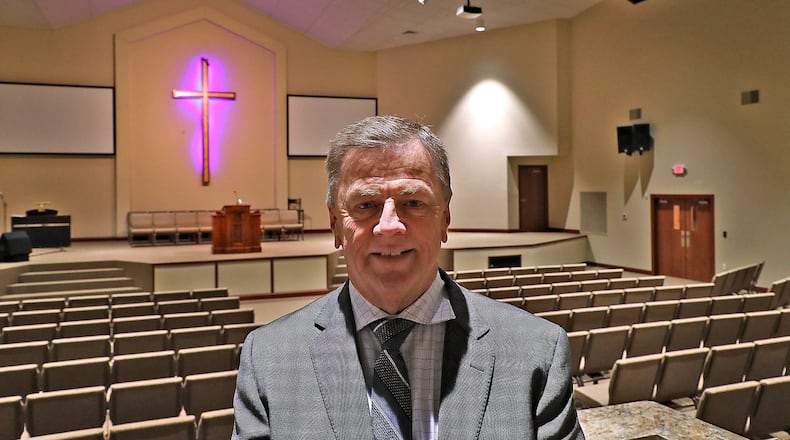 Orbie Estep, senior pastor at Grace Missionary Baptist Church, in the sanctuary of the new 25,000 square foot church. The church, located on the site of the old Kenwood Elementary, is having an open house Saturday for anyone who wants to stop in and see the new church. BILL LACKEY/STAFF