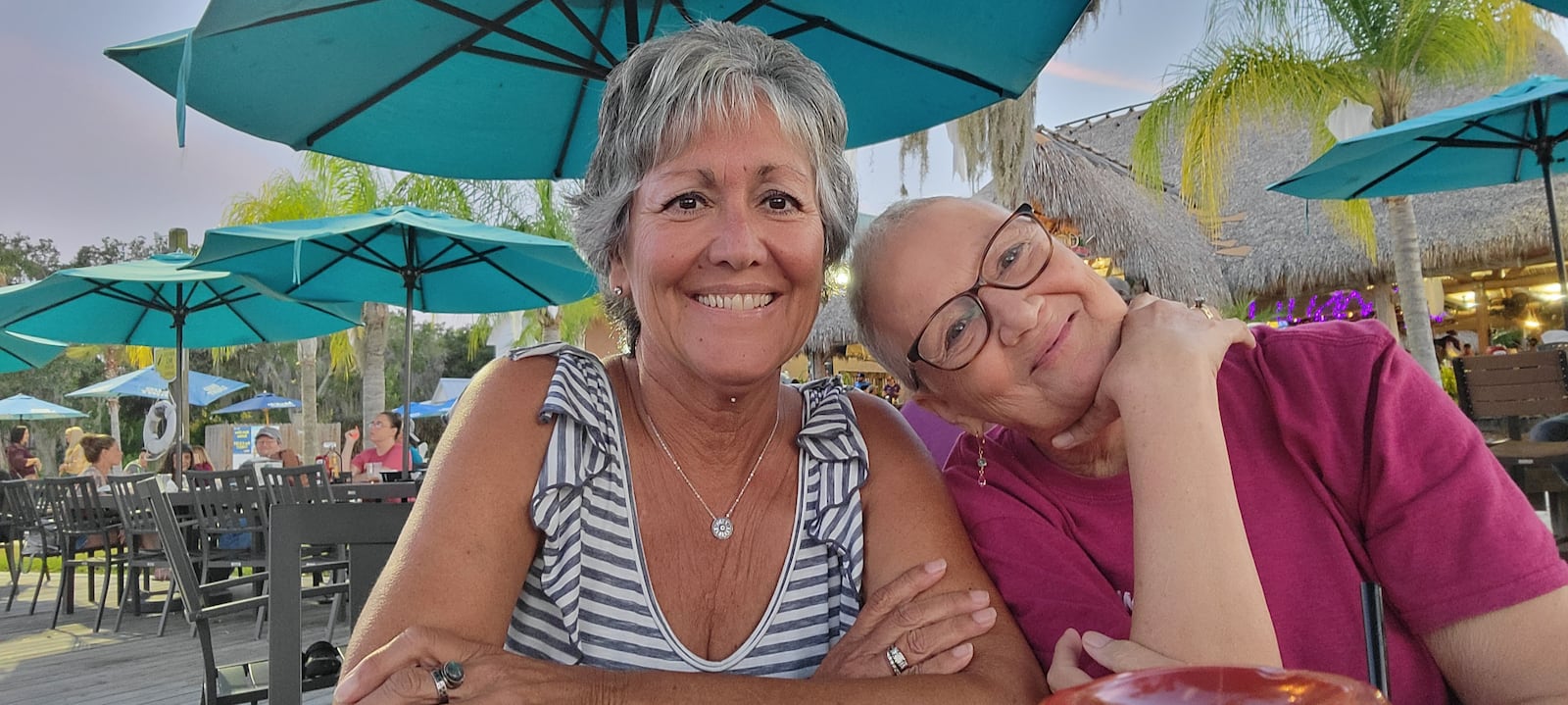 After ringing a bell to celebrate the end of one phase of treatment, Zimmer, right, traveled to Florida to visit lifelong friend Tina Stathopoulous Holt, who was being treated for the liver cancer she did not survive. CONTRIBUTED