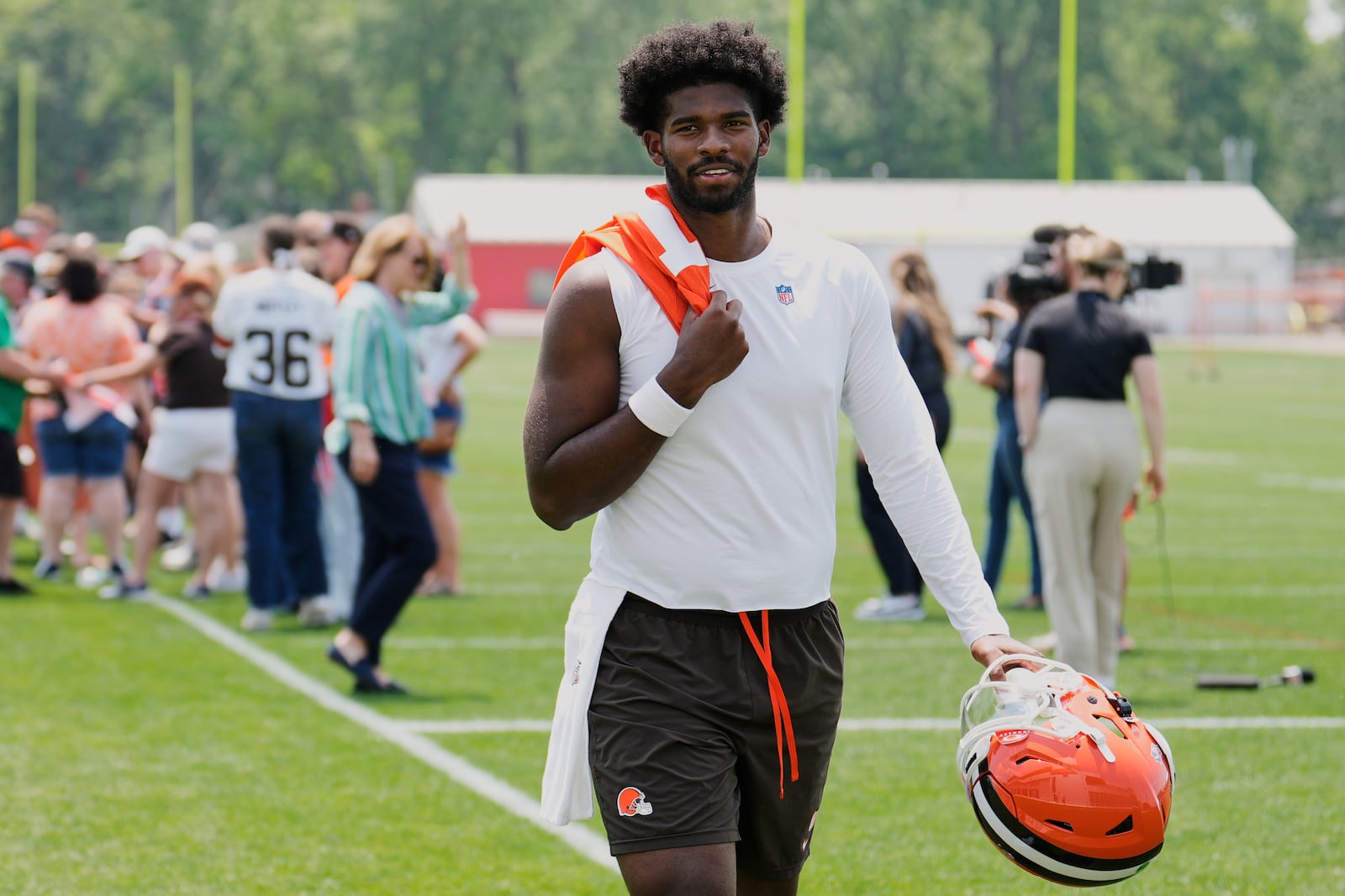 Cleveland Browns quarterback Shedeur Sanders walks off the field after an NFL football practice in Berea, Ohio, Wednesday, June 4, 2025. (AP Photo/Sue Ogrocki)