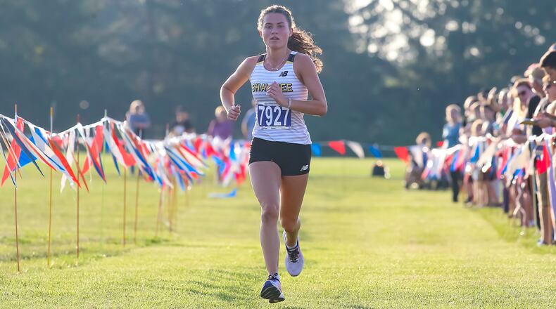 Shawnee High School senior Audrey DeSantis runs to the finish line during the Clark County cross country championship on Tuesday evening at Northwestern High School. DeSantis won for the third time in four seasons in a time of 19 minutes, 54 seconds. CONTRIBUTED PHOTO BY MICHAEL COOPER