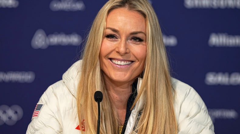 United States' Lindsey Vonn smiles during a press conference by the U.S. ski team at the 2026 Winter Olympics, in Cortina d'Ampezzo, Italy, Tuesday, Feb. 3, 2026. (AP Photo/Fatima Shbair)
