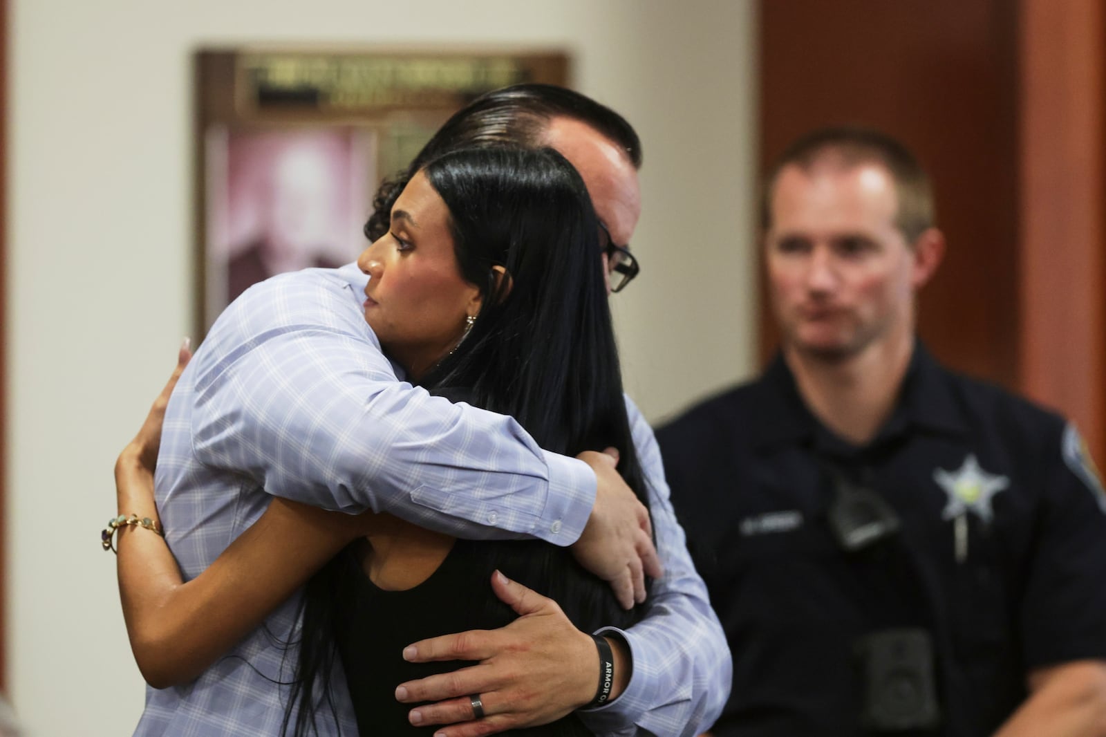 Steve Goncalves, father of victim Kaylee Goncalves hugs his daughter Alinea after speaking at the sentencing hearing of Bryan Kohberger at the Ada County Courthouse, Wednesday, July 23, 2025, in Boise, Idaho, for brutally stabbing four University of Idaho students to death nearly three years ago. (AP Photo/Kyle Green, Pool)