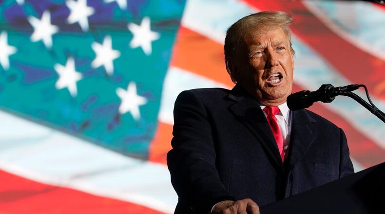 Former President Donald Trump speaks at a campaign rally in support of the campaign of Ohio Senate candidate JD Vance at Wright Bros. Aero Inc. at Dayton International Airport on Monday, Nov. 7, 2022, in Vandalia, Ohio. (AP Photo/Michael Conroy)