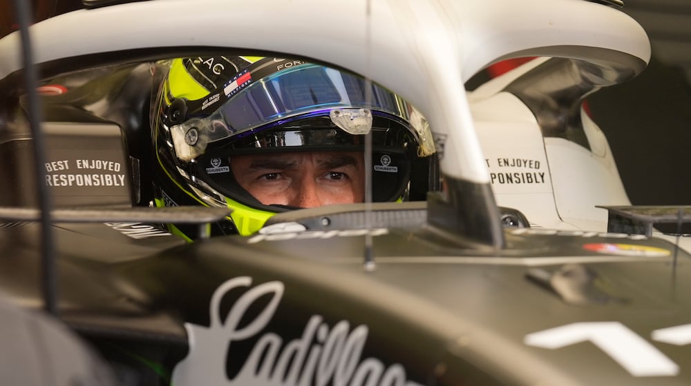 Cadillac driver Sergio Perez of Mexico waits in his car during a Formula One pre-season test at the Bahrain International Circuit in Sakhir, Bahrain, Wednesday, Feb. 11, 2026. (AP Photo/Altaf Qadri)