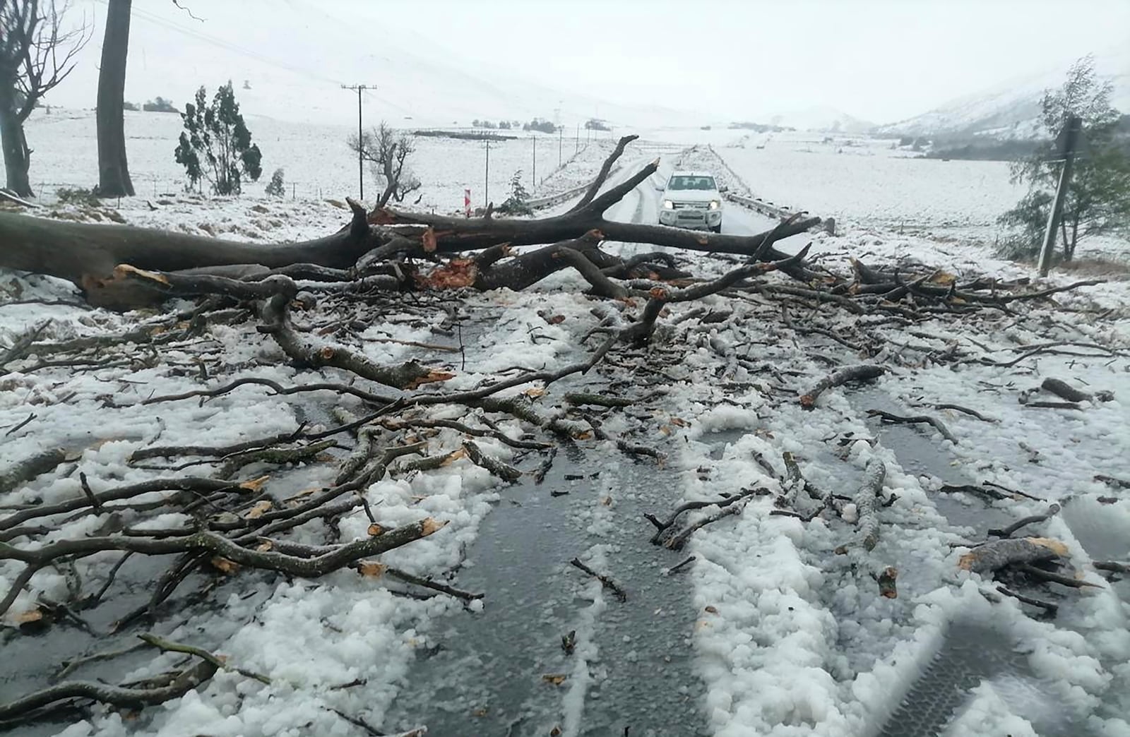Snow covers the N2 road heading to Nolangeni, South Africa, Tuesday, June 10, 2025. (Greater Kokstad Municipality via AP)
