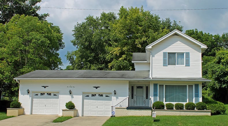 Surrounded by mature trees, the 3-bedroom home has about 1,610 sq. ft. of living space. Various improvements have updated the home built in 1881. CONTRIBUTED PHOTO BY VICKIE KAPNAS