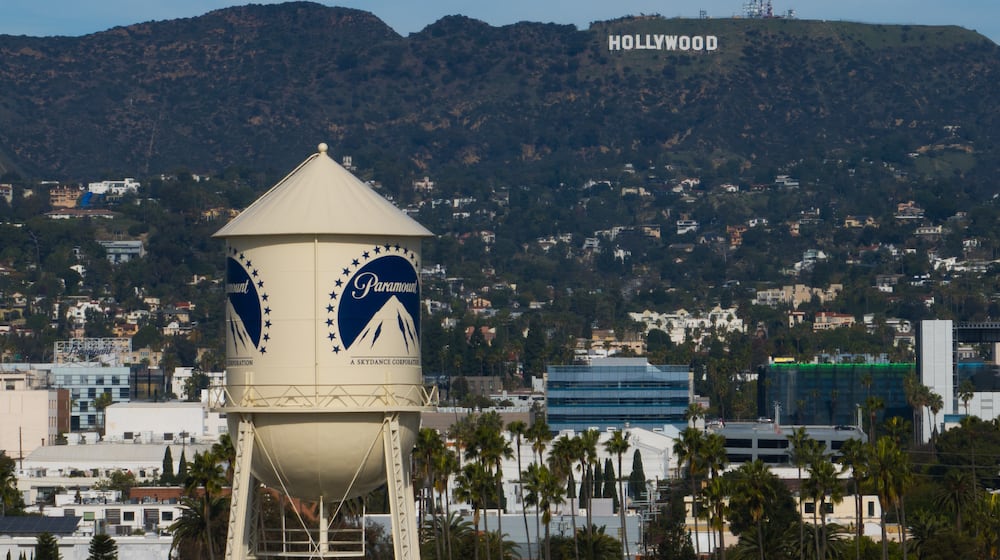 The Paramount Pictures water tower is seen in Los Angeles, Thursday, Dec. 18, 2025, with the Hollywood sign in the distance. (AP Photo/Jae C. Hong)