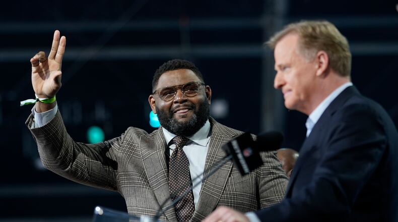 NFL Hall of Famer Orlando Pace waves as he is introduced before the second round of the NFL football draft, Friday, April 30, 2021, in Cleveland. (AP Photo/Tony Dejak)
