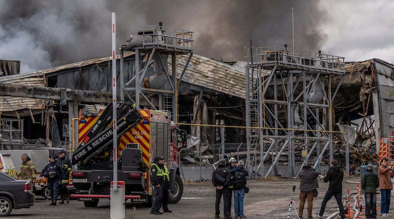 Smoke bellows from a warehouse that caught fire following a Russian attack, Saturday, Oct. 25, 2025, in Kyiv, Ukraine. (AP Photo/Julia Demaree Nikhinson)