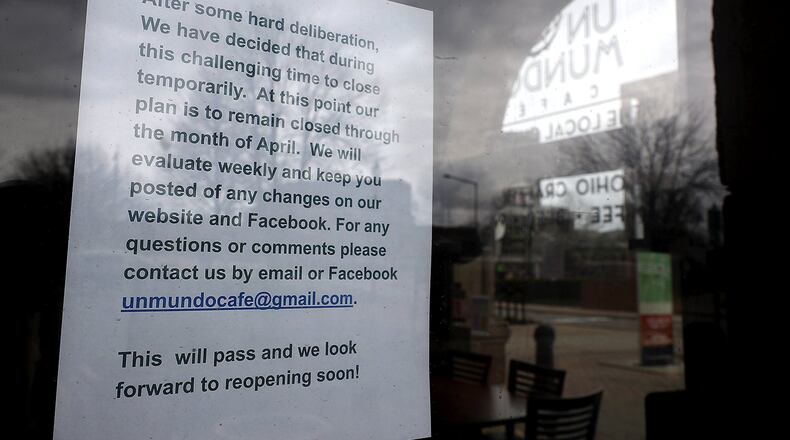Un Mundo Cafe has temporarily closed after trying to stay open for carryout due to the coronavirus pandemic. BILL LACKEY/STAFF