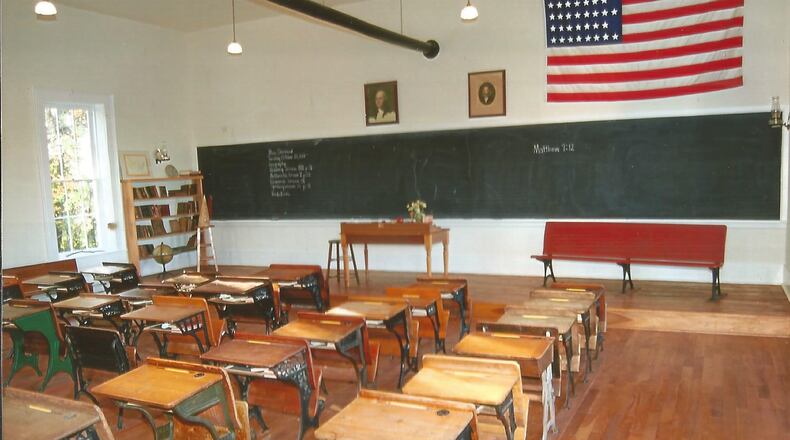 Interior photo showing rows of wooden desks donated by community members to the Advance one-room school house. Photo submitted by the school.