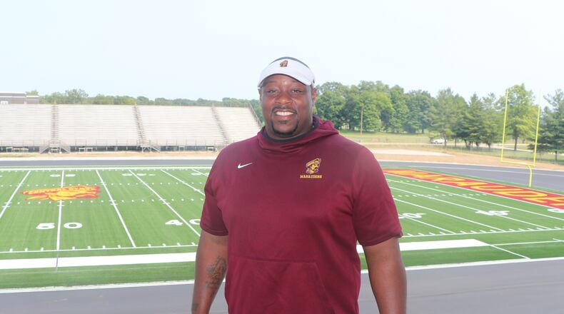 Central State University head football coach Bobby Rome with the new football field at McPherson Stadium behind him. Nick Novy/Central State University