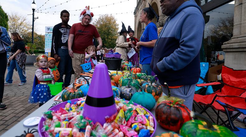 Hundreds of creepy and cute characters filled the sidewalks and streets in downtown Springfield for the seventh annual Downtown Springfield Trick or Treat Friday, Oct. 25, 2024. Downtown merchants, community organizations and nonprofits passed out candy, Halloween characters roamed the sidewalks and danced in the street. BILL LACKEY/STAFF