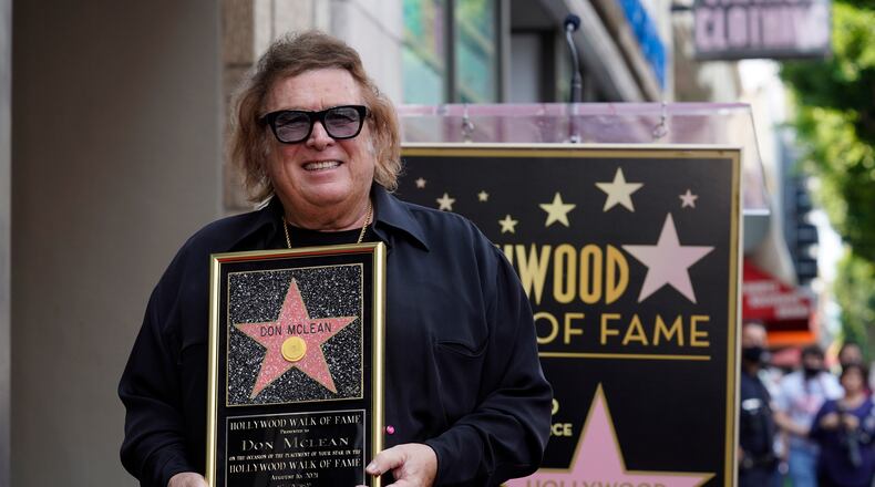 "American Pie" singer/songwriter Don McLean poses with a replica of his new star on the Hollywood Walk of Fame during a ceremony for him, Monday, Aug. 16, 2021, in Los Angeles. (AP Photo/Chris Pizzello)