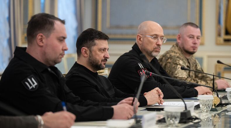 President of Ukraine Volodymyr Zelenskyy, second left, listens to British Defense Secretary John Healey during their meeting in Kyiv, Ukraine, Friday, Jan. 9, 2026. (AP Photo/Danylo Antoniuk)