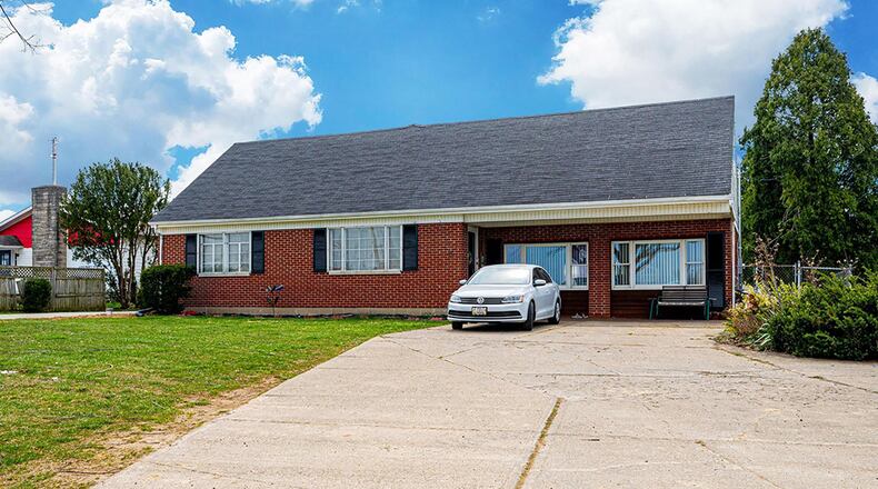 This story-and-a-half home with about 1,750 sq. ft. of space features 4 bedrooms, a covered front porch, 3-season room and basement. CONTRIBUTED PHOTO