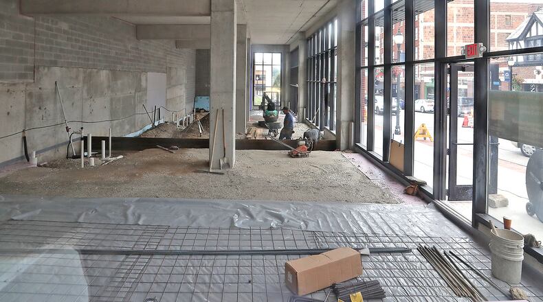 Work has begun on the retail spaces attached to the parking garage along North Fountain Avenue Thursday. BILL LACKEY/STAFF