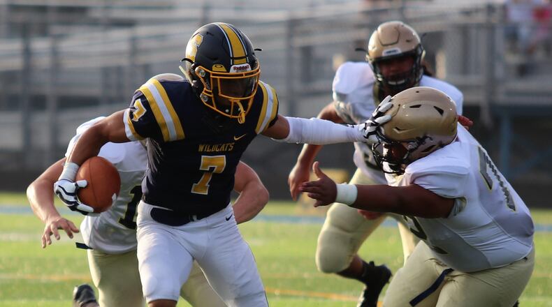 Springfield High School senior Michael Brown-Stephens stiff arms a defender during the Wildcats’ 20-14 victory over Lancaster at Evans Stadium on Friday, Aug. 24, 2018. Michael Cooper/CONTRIBUTED