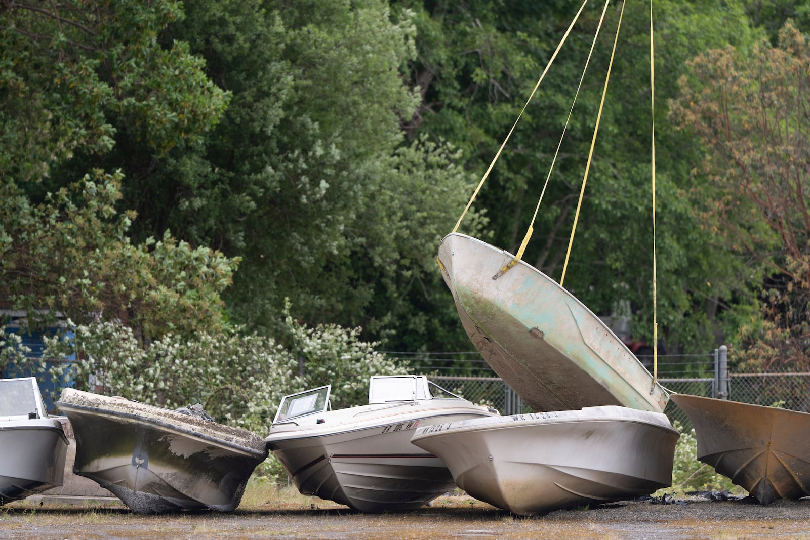 An abandoned ship is lowered from a helicopter on Wednesday, June 4, 2025, in Olympia, Wash. (AP Photo/Jenny Kane)