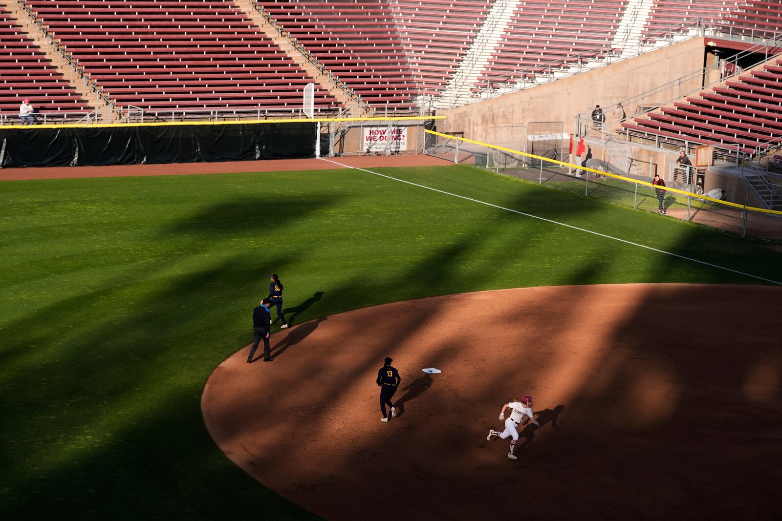 Stanford's Jade Berry, right, runs past second base on her way to score against California on Kyra Chan's double during the first inning of an NCAA college softball game Thursday, April 17, 2025, in Stanford, Calif. (AP Photo/Godofredo A. Vásquez)