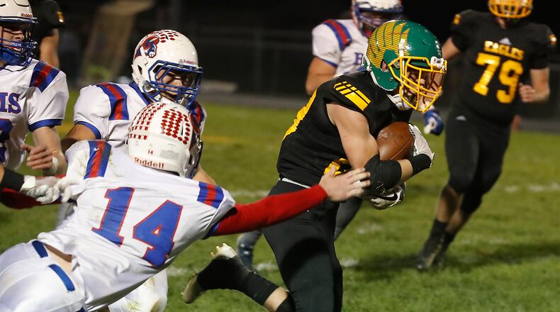 Greeneview’s Caden Anderson dives as he tries to tackle Madison-Plains’ Conner Jones during a Week 10 game. The Rams lost to CHCA on Friday night in the first round of the Division V, Region 20 playoffs. Bill Lackey/Staff