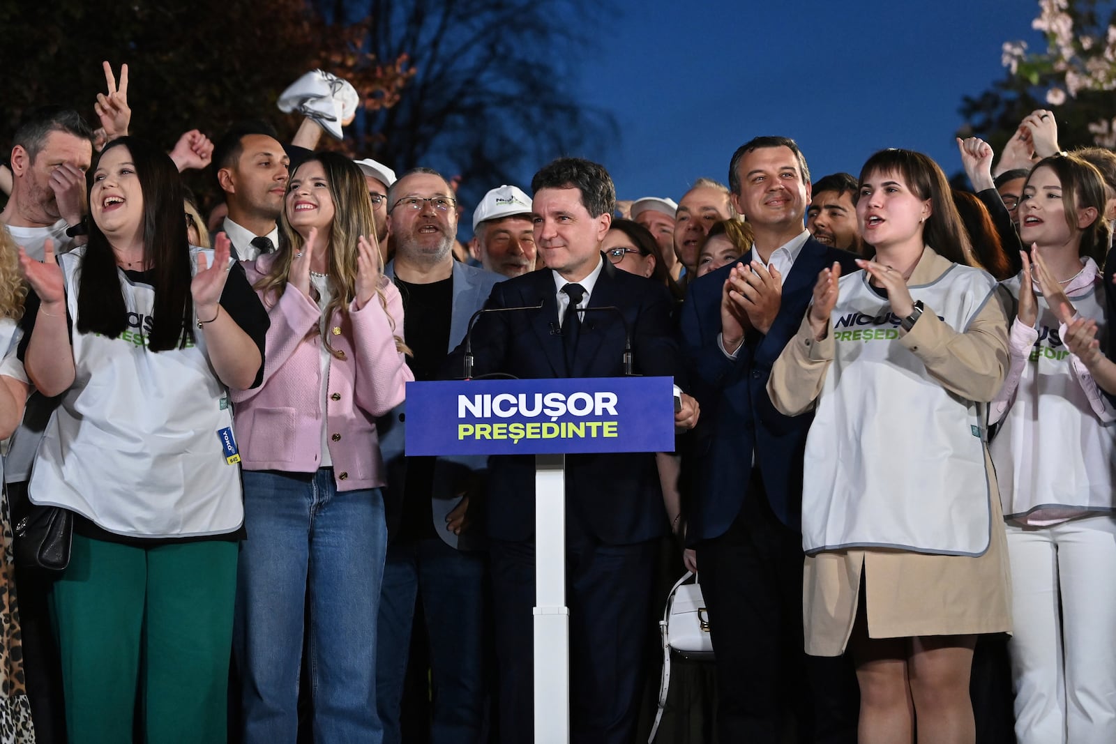 Presidential candidate Nicusor Dan smiles after polls closed for the first round of the country's presidential election redo in Bucharest, Romania, Sunday, May 4, 2025. (AP Photo/Eduard Vinatoru)