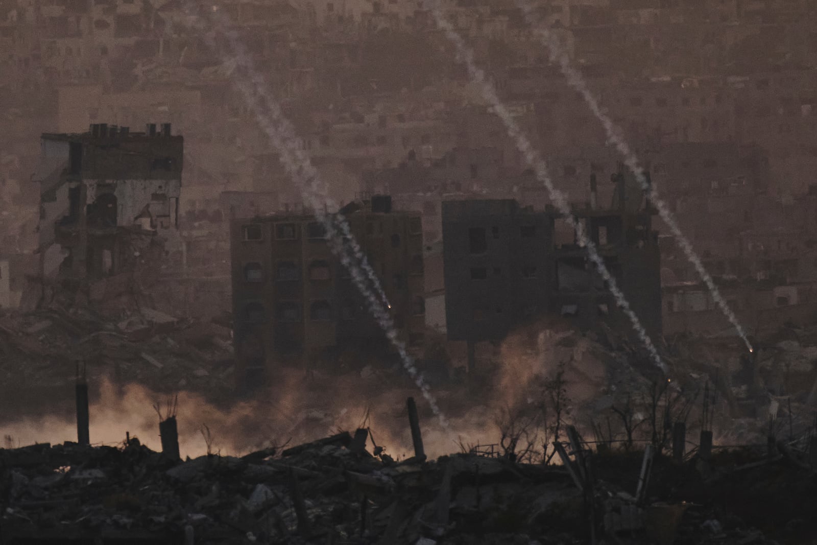 Israeli shelling hits an area in the northern of Gaza Strip as seen from southern Israel, Tuesday, June 3, 2025. (AP Photo/Leo Correa)