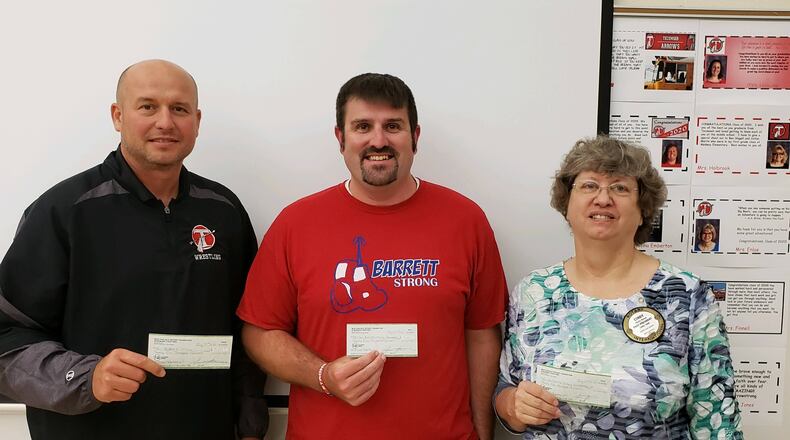 Jacob Berner, representing Tecumseh Strong, Brad Fitzsimmons for Barrett Strong, and Cindy Gracy, the President of New Carlisle Rotary Club partnered for a fundraiser. Submitted by Scott Griffith.