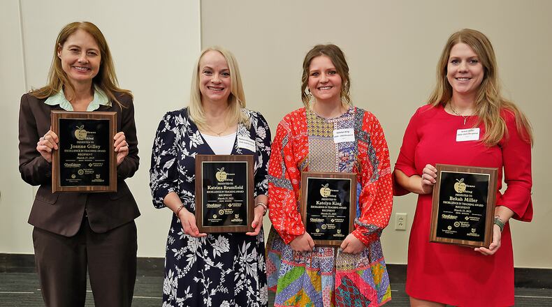 This year's winners of the Excellence in Teaching Award pose for pictures the presentation at the Springfield Rotary Club luncheon Monday, March 27, 2023. The winners are, from left, Joanne Gilley from Shawnee Middle School, Katrina Brumfield from Lincoln Elementary, Katelyn King from Hayward Middle School and Bekah Miller from the Global Impact STEM Academy. BILL LACKEY/STAFF