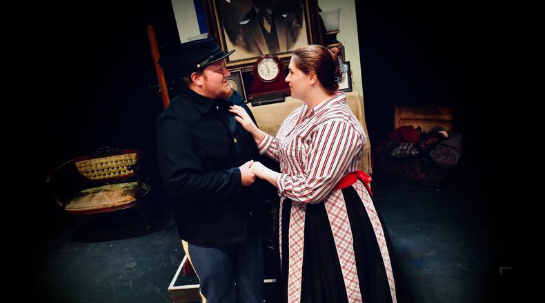 Anthony Reed, left and Emily Pierce in period costume rehearse a scene from "Little Women the Musical" that will be performed Thursday through Saturday at the John Legend Theater.