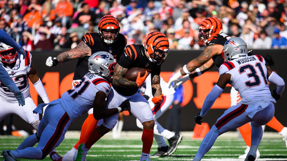 Chase Brown runs the ball in the second quarter of their game against the New England Patriots on Saturday, Nov. 23, 2025 at Paycor Stadium. JEREMY MILLER / CONTRIBUTED PHOTO
