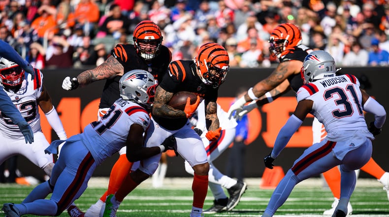 Chase Brown runs the ball in the second quarter of their game against the New England Patriots on Saturday, Nov. 23, 2025 at Paycor Stadium. JEREMY MILLER / CONTRIBUTED PHOTO