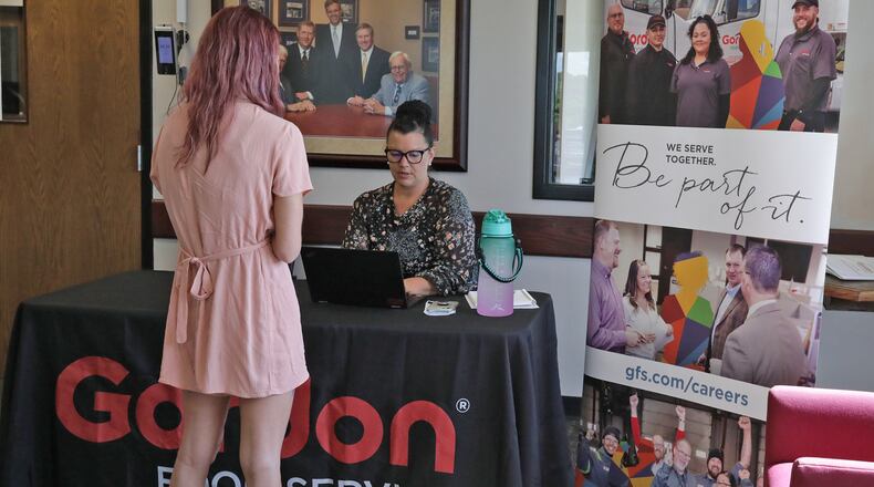 Michelle Brandel, human resource director at Gordon Food Service, talks to a job applicant during a hiring event at the company's distribution facility in Springfield on Tuesday. Even as the unemployment rate in Clark County is up, employers are holding job events to try to fill open positions. BILL LACKEY/STAFF