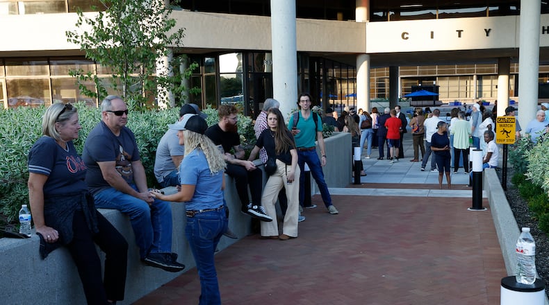 A crowd of people wait outside the Springfield City Commission Meeting, unable to get inside because capacity had been reached in the City Hall Forum Tuesday, Sept. 10, 2024. BILL LACKEY/STAFF