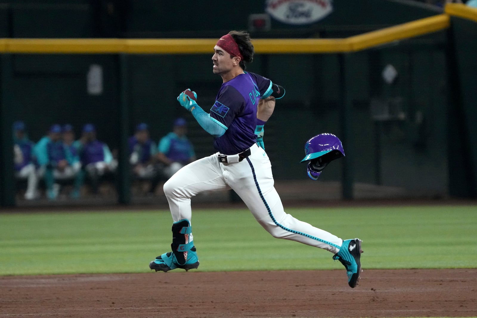 Arizona Diamondbacks' Corbin Carroll runs after hitting a triple against the Los Angeles Dodgers in the third inning during a baseball game, Saturday, May 10, 2025, in Phoenix. (AP Photo/Rick Scuteri)