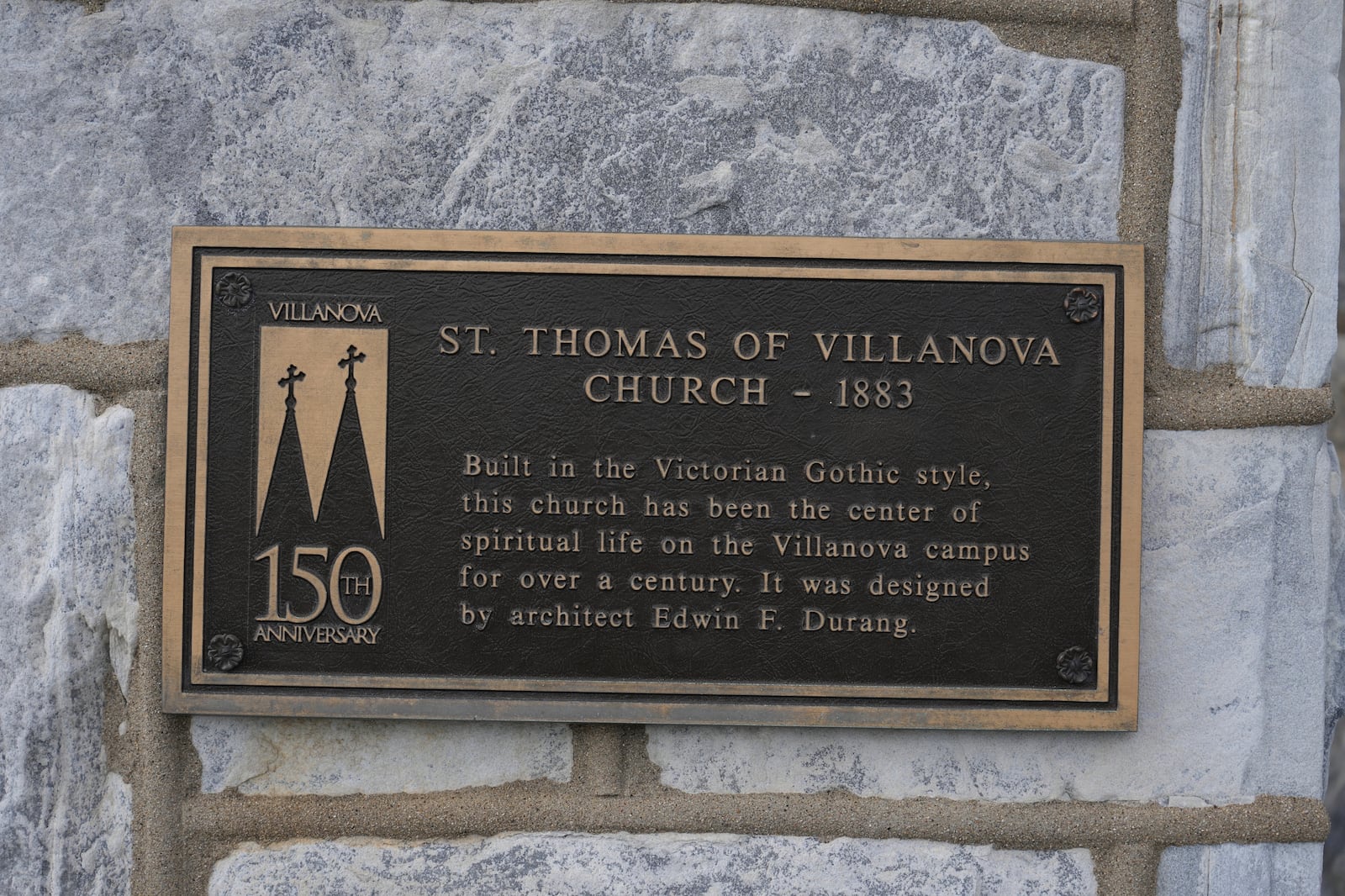 An informational sign is displayed on St. Thomas of Villanova Church on the Villanova University campus Thursday, May 8, 2025 in Villanova, Pa. (AP Photo/Matt Slocum)
